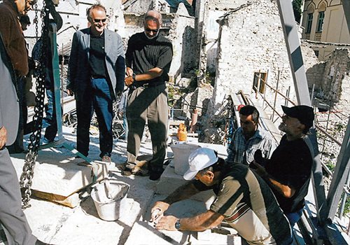 Architect Amir Pašić (in gray jacket) supervises the bridge’s reconstruction.