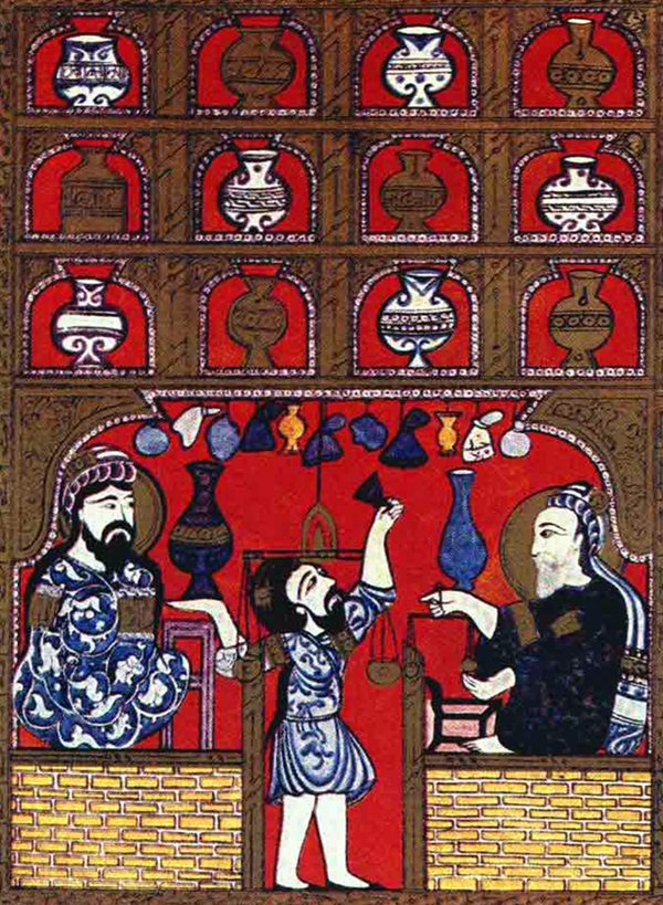 Flanked by ﬁgures indicating his tutelage from master physicians (the ﬁgure on the right may represent ﬁrst-century Greek physician Dioscorides), a <em>saydalani</em>&mdash;as an early pharmacist was called in Arabic&mdash;is shown at work in his dispensary, in which hang a variety of vessels for alchemical production. The illustration comes from 12th-century Iraq.
