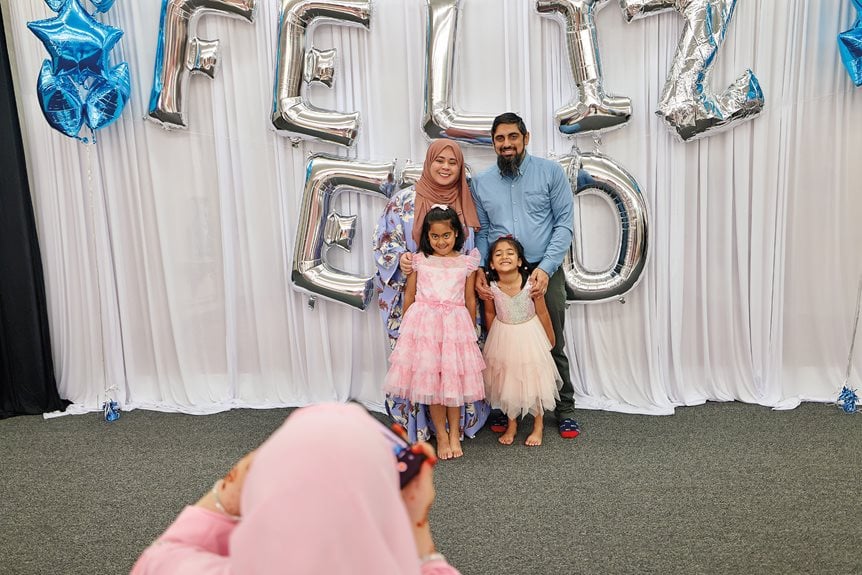 Members of the diverse community at IslamInSpanish celebrate Eid. The space was decorated with mylar balloons spelling “Happy Eid” in Spanish.