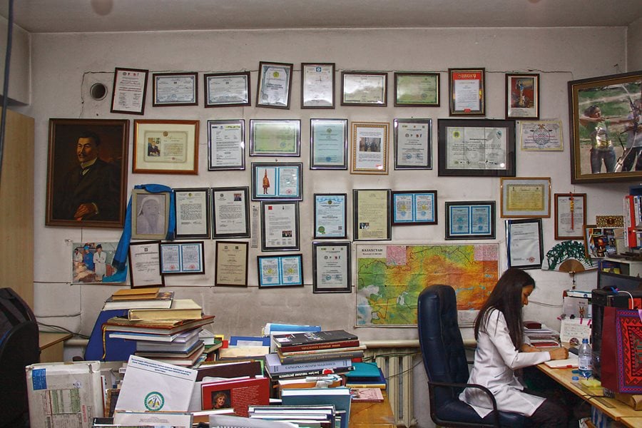 Elina Altynbekova works with her father, her twin sister, Dana, and their mother, Saida, to preserve her country's heritage.
