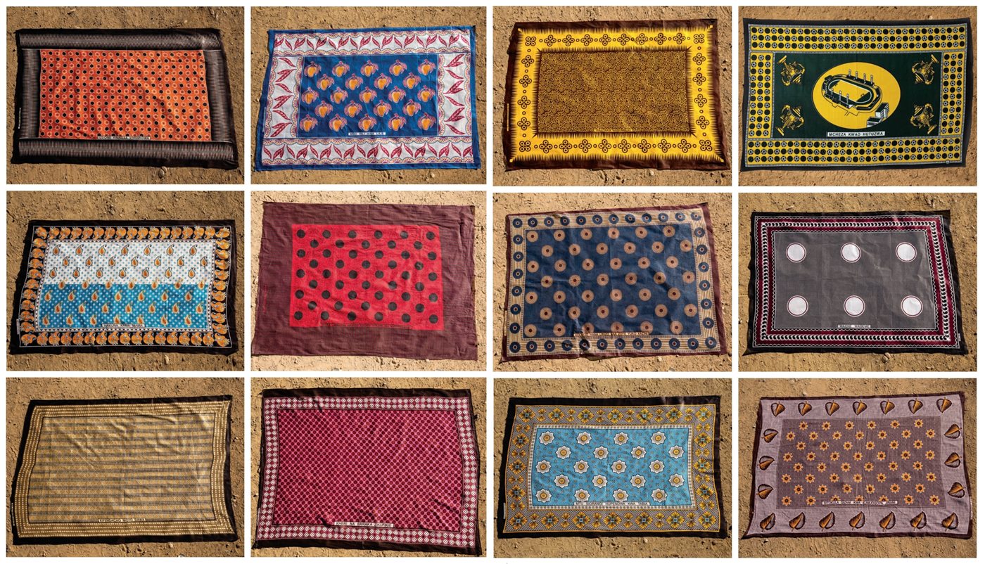 <p>Long a form of social media, a kanga communicates through design, color and especially the <em>jina</em> (&ldquo;message&rdquo;) that generally appears at the bottom of each <em>mji</em>, or central panel. <em>Left six, clockwise from top left</em>, and translated colloquially, these kanga say: &ldquo;Don&rsquo;t see [your beauty or success] as something achieved alone; it&rsquo;s been made possible by others&rdquo;; &ldquo;A person doesn&rsquo;t have this, but they have that&rdquo;; &ldquo;There is no one like mom&rdquo;; &ldquo;Better to be poor like me than to be rich like my friend&rdquo;; &ldquo;That which loves your heart is medicine&rdquo;; and &ldquo;May the best of all blessings come to you.&rdquo;</p>

<p>Right six, clockwise from top left: “A respectable person is not troubled”; “The one who plays at home is rewarded”; “A liar never takes a break; they’re at work 24/7”; “Let them talk”; “A person is not their color; they are loved for their character”; and “I won’t eat in the darkness for fear of my neighbor (I do what I want!).”</p>

