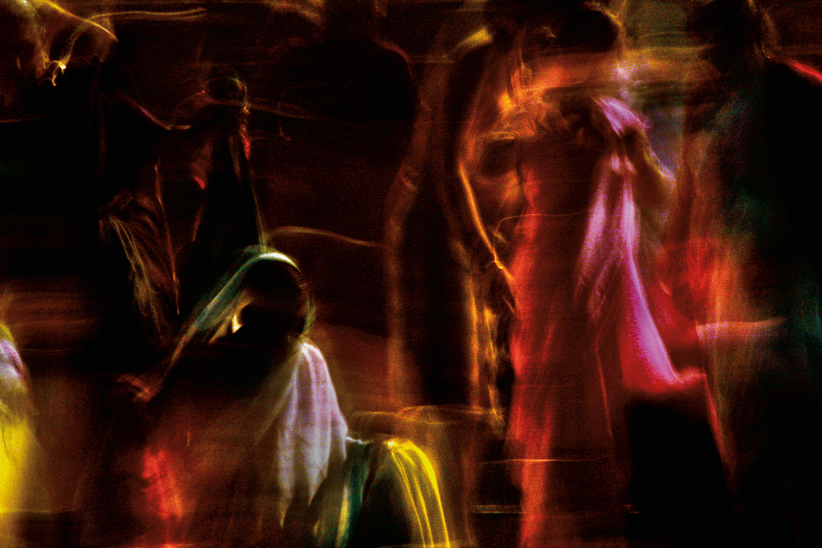 My mother kneels down to lift me off the ground, and as she does, the sheer fabric of the scarf covering her hair shifts in the summer breeze that smells of jasmine.