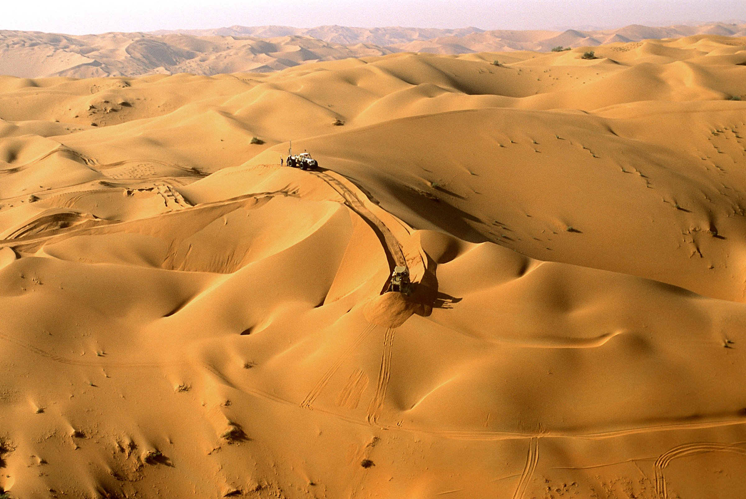 This aerial image, shot in 1993, shows one of Aramco’s deep-desert road-building teams carving over and around 100-meter dunes in the eastern reaches of the Rub al-Khali, or Empty Quarter, on the way to Shaybah, the most remote oilfield in Saudi Arabia. 