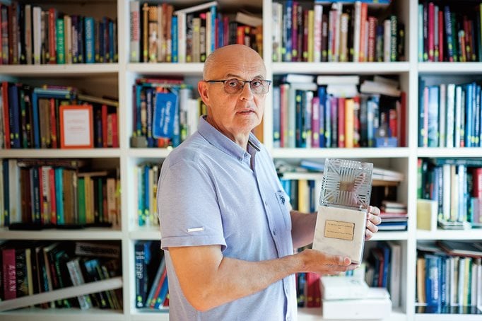 Architect Tihomir Rozić, who was a member of the Old Town Mostar conservation project, holds the Aga Khan Award given to the team in 1986. 
